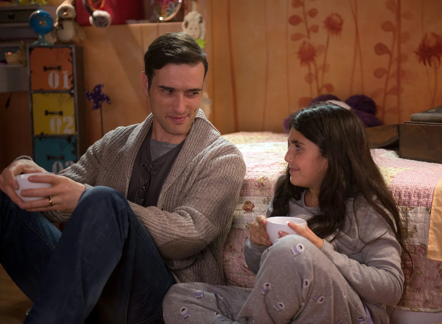 Ed Stoppard as Ted Strangelove with his daughter Ruby sharing hot cocoa.