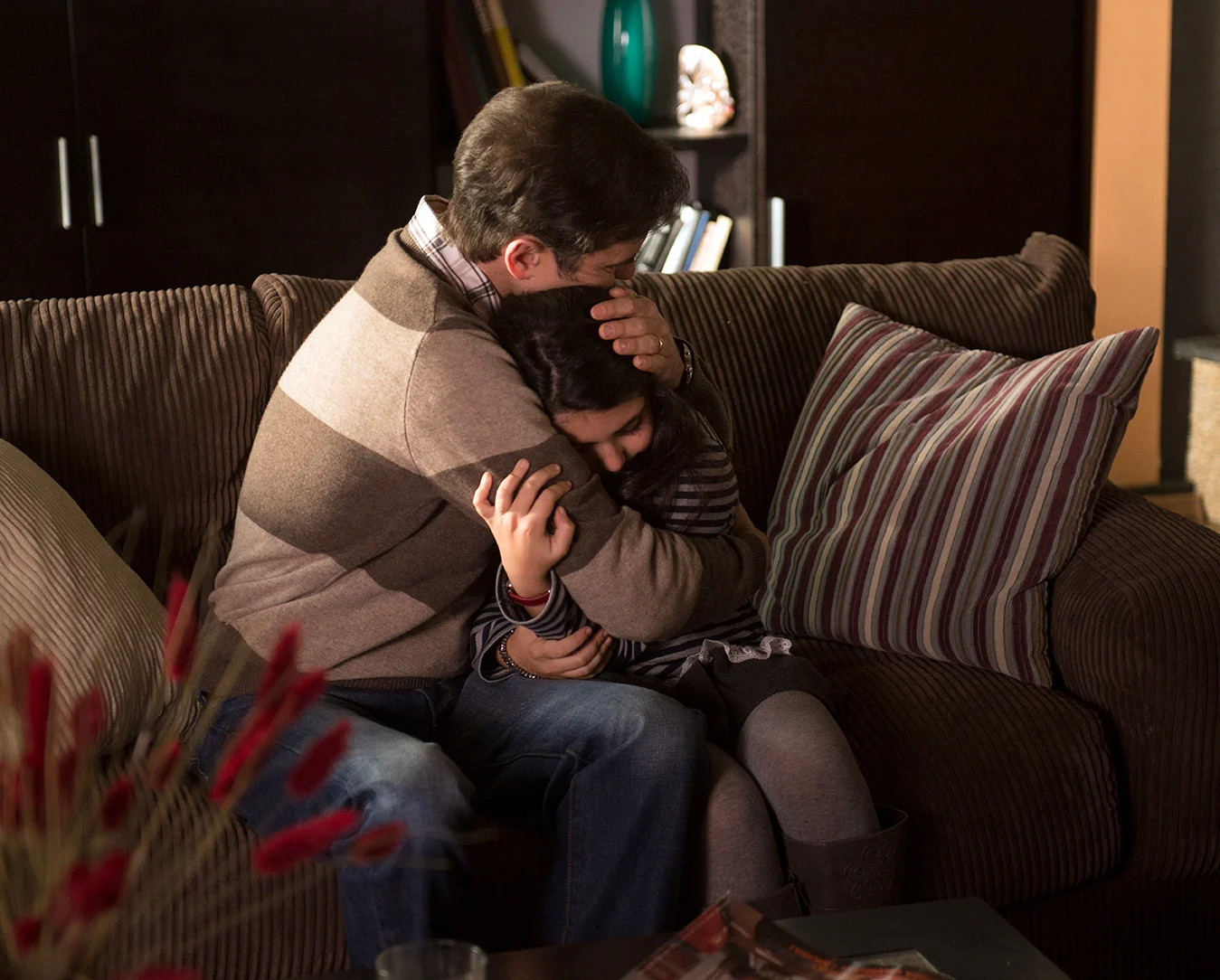 A tender moment shared between a father and his daughter