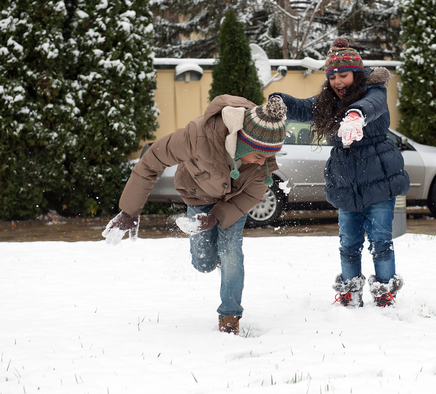 Scooter and Ruby have a snowball fight.