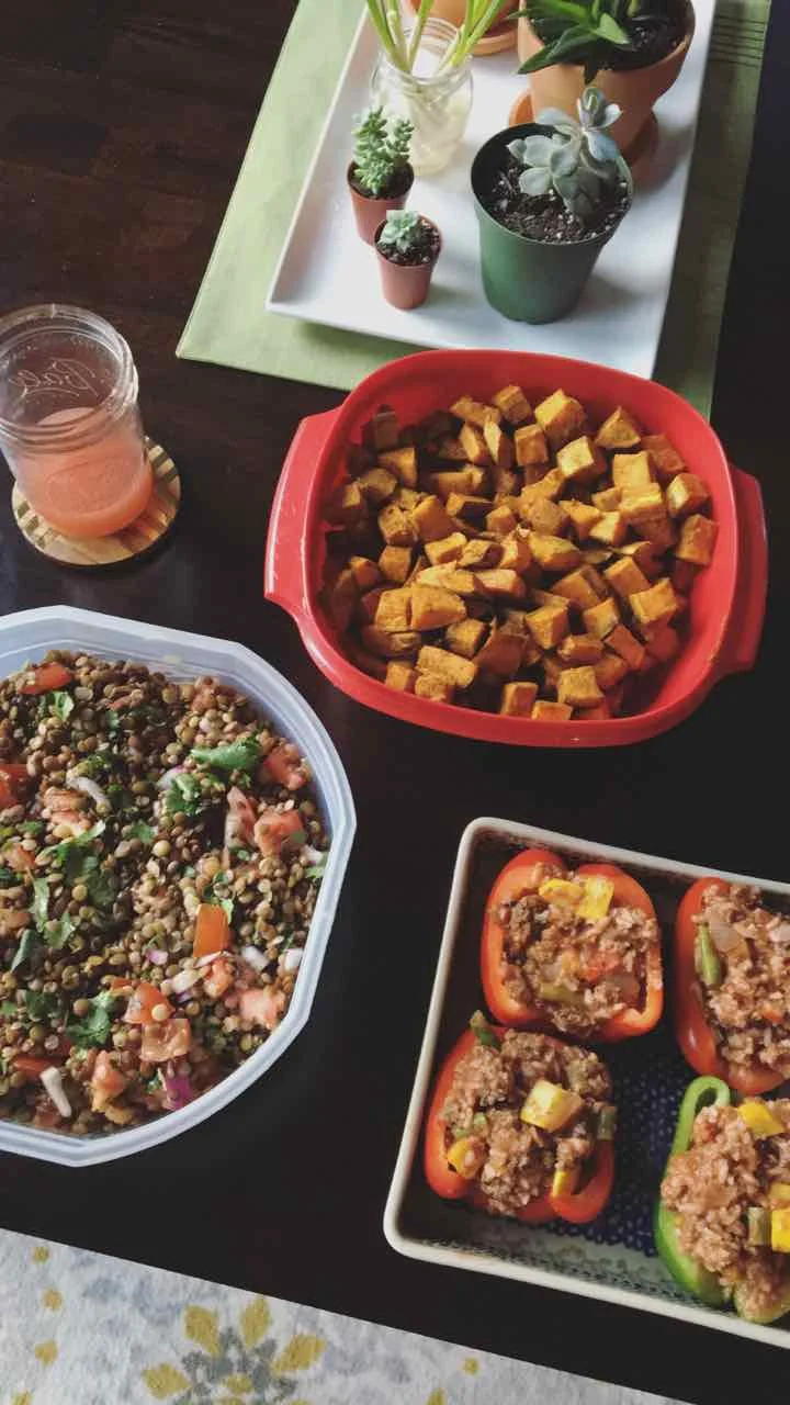 Spicy lentil salad, roasted sweet potatoes, and stuffed peppers.