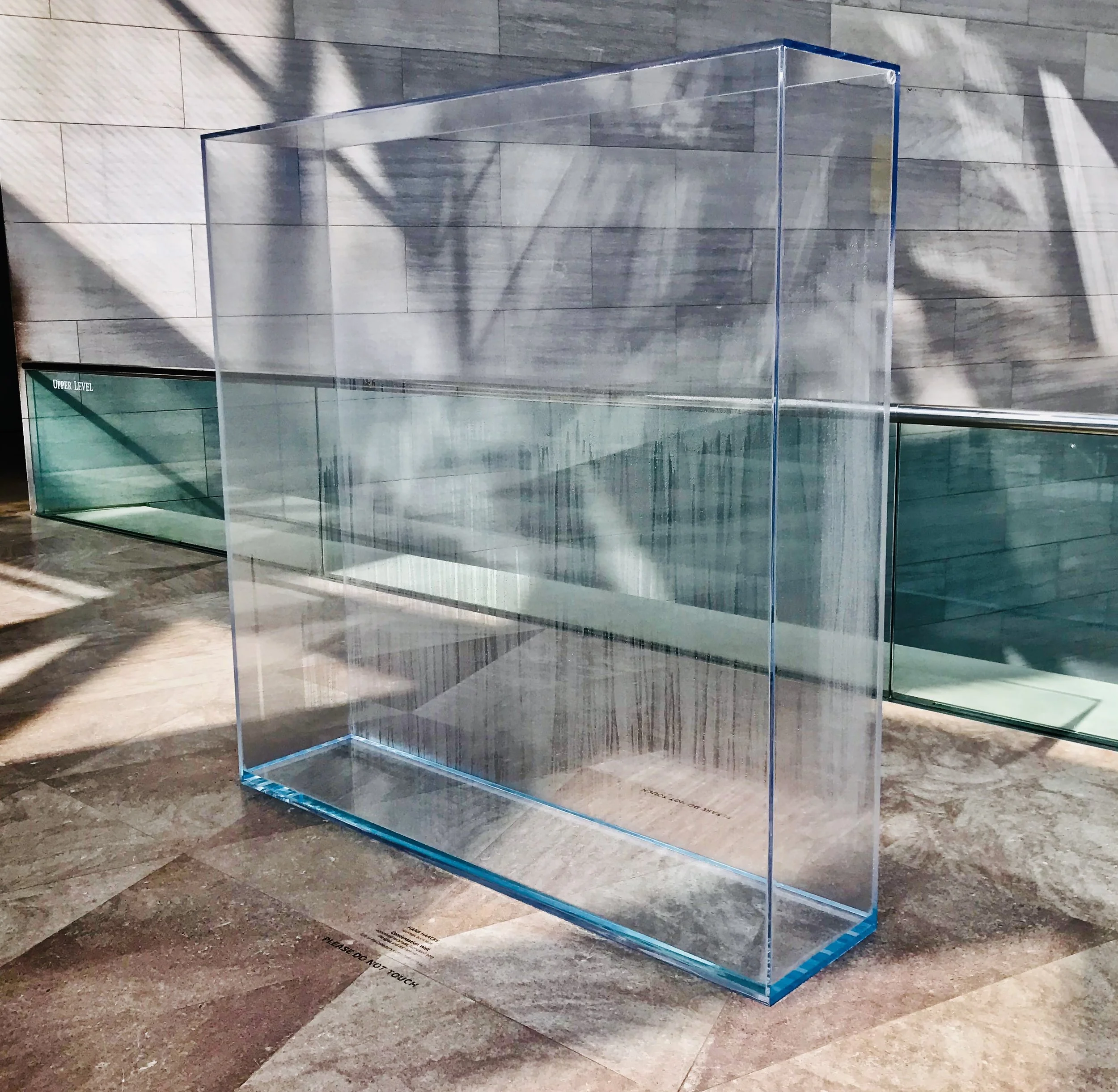 Hans Haacke, Condensation Wall, conceived 1963/1966, fabricated 2016, Plexiglas and distilled water, overall: 177.8 × 177.8 × 40.6 cm (70 × 70 × 16 in.)National Gallery of Art, Gift of the Collectors Committee, 2013.44.1. Photograph by Emily Lanza.