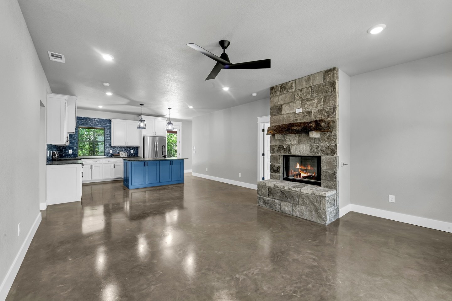 We just wrapped up this beautiful barndo, and we&rsquo;re loving how it all came together! From the bold blue island to the cozy stone fireplace with a reclaimed wood mantle, every detail was thoughtfully designed to bring warmth, personality, and pu