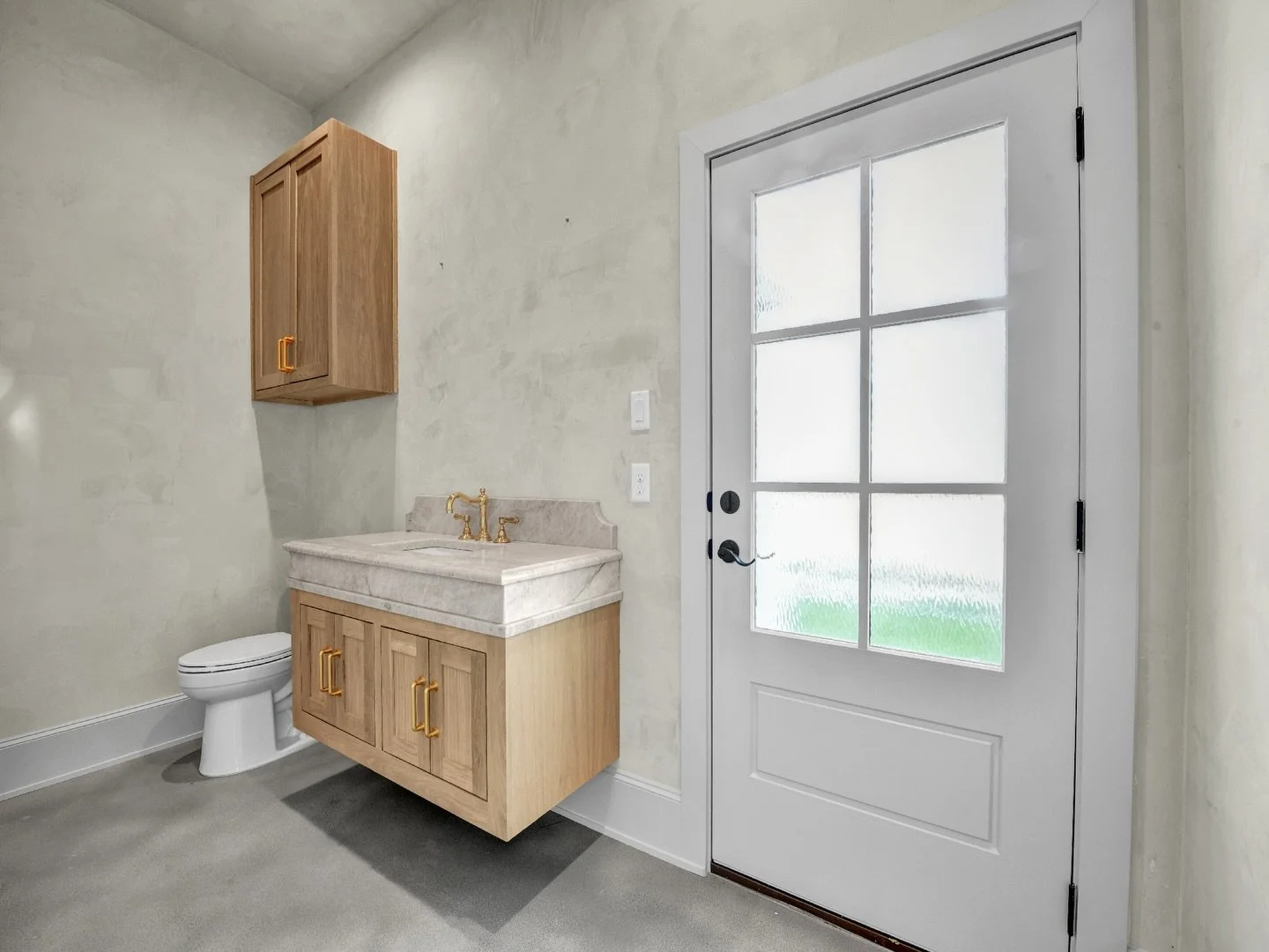 A floating vanity can be the perfect mix of form and function in a small space. Not only does it give a clean, modern look&mdash;it also makes the room feel more open and gives you flexibility with finishes and flooring. This one is anchored by beaut