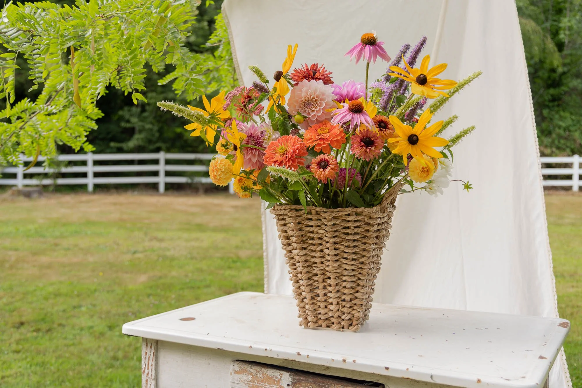 Design-led summer arrangement of dahlias, rudbeckia and coneflowers from the White Brick garden.