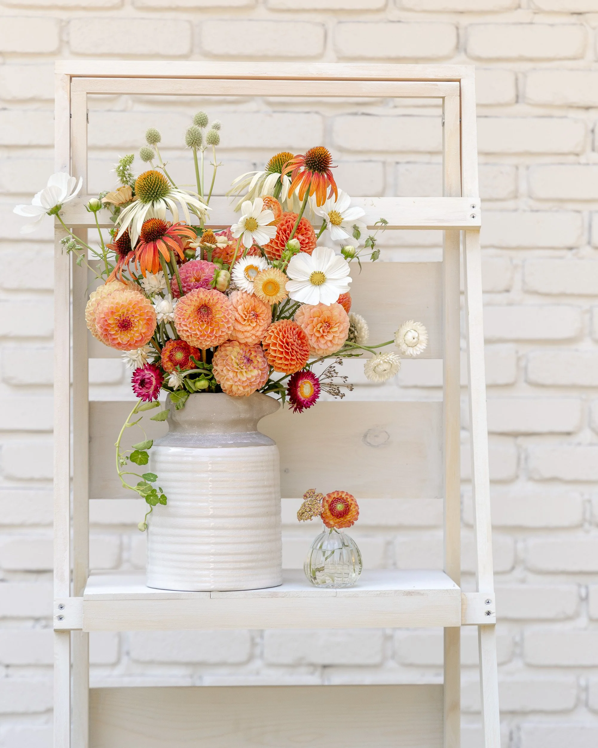 Late-summer bouquet with apricot dahlias, echinacea, feverfew and seasonal garden flowers grown at White Brick Flower Farm in Redmond, Washington.