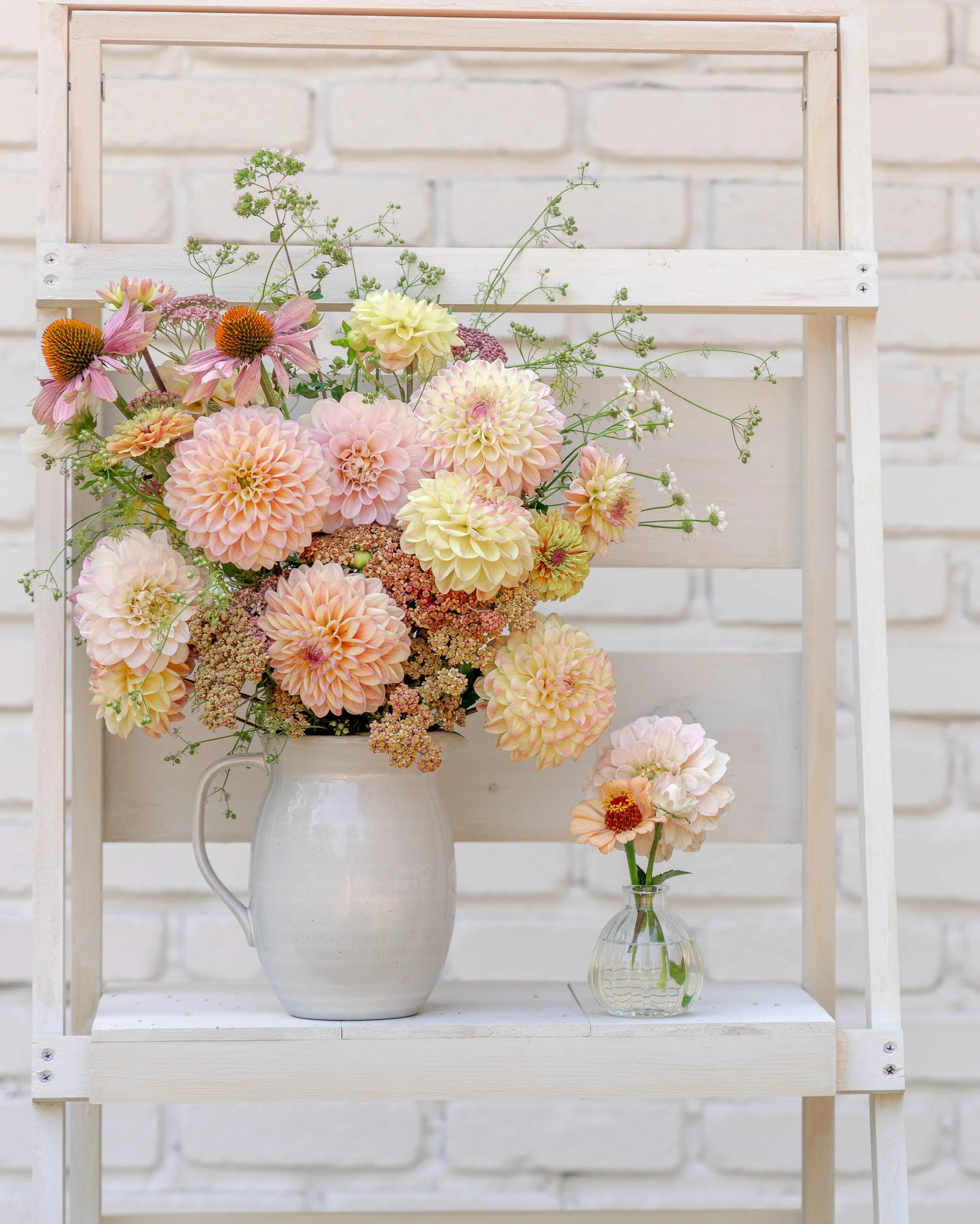 Soft apricot and cream dahlia bouquet with delicate seasonal stems, grown and arranged at White Brick Flower Farm in Redmond, Washington.