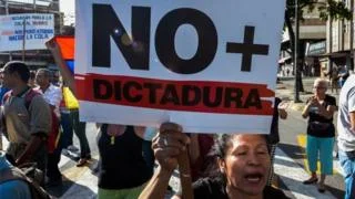 Photo: Anti-government protesters in Venezuela accusing President Maduro of moving towards a dictatorship Photo Courtesy: AFP