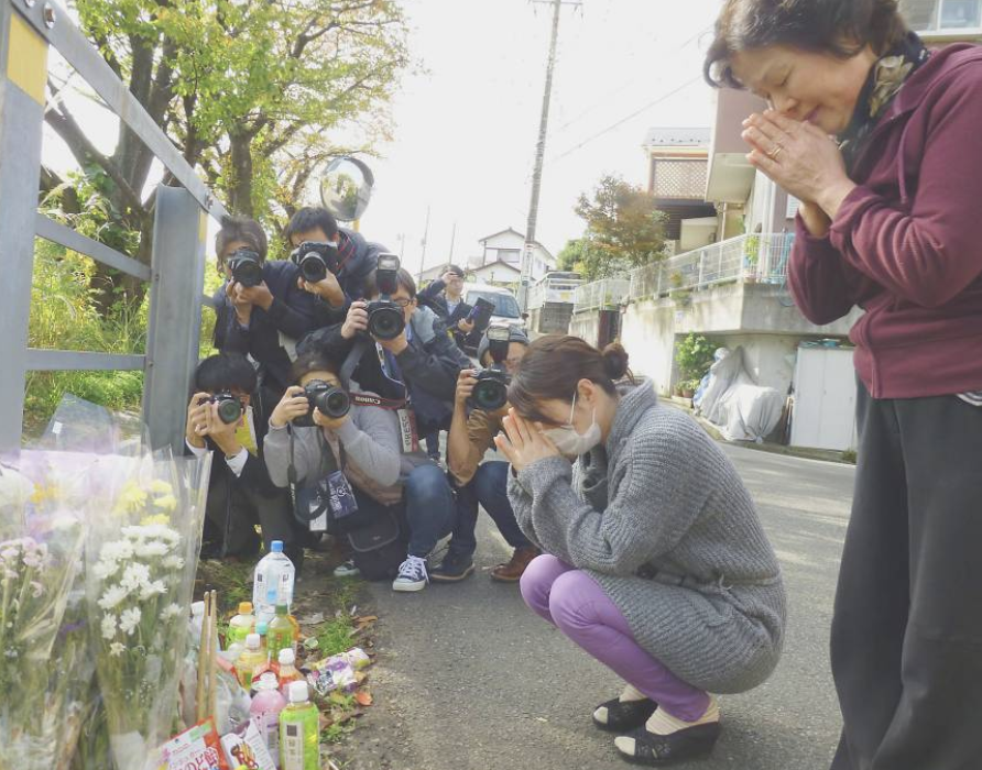Photograph showing Shirahishi’s victim’s relatives mourning Credit: Japan Times