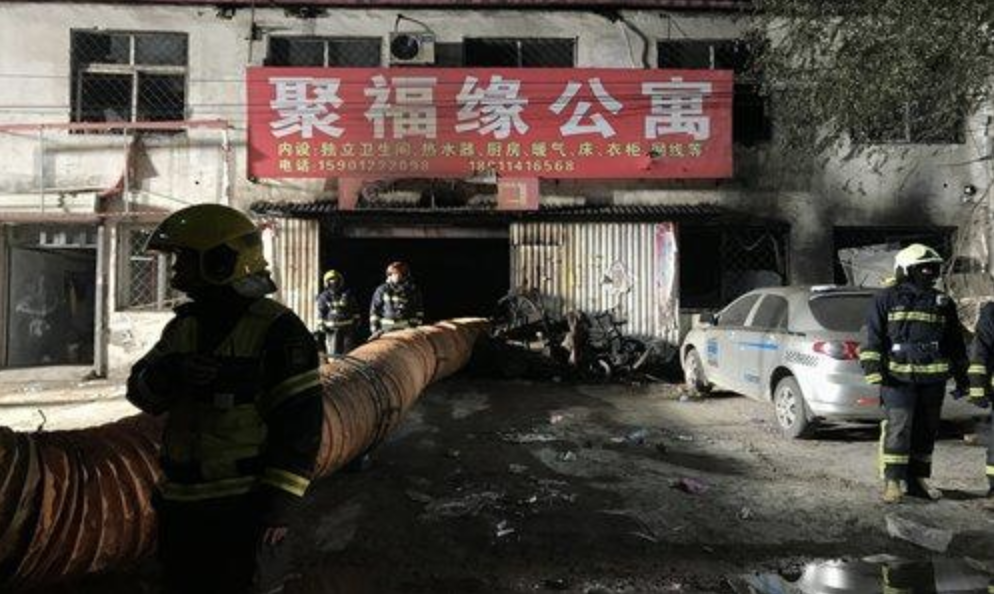 Firefighters walked the site of a fire that killed 19 people in the Daxing district. Source: Visual China Group