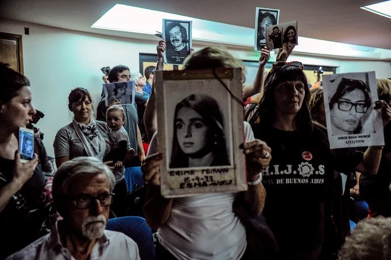 Relatives of those who disappeared listen to the sentencing hearing in Buenos Aires on Wednesday (New York Times)