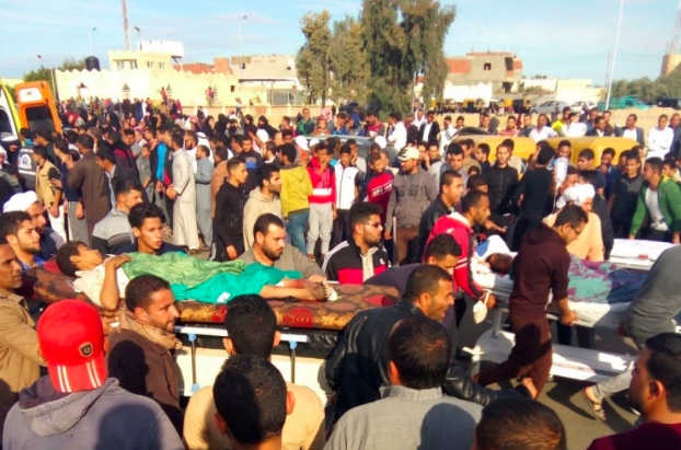 Citizens of the Egyptian Sinai carry a wounded victim of the al-Rawda massacre. (AFP/Getty Images)