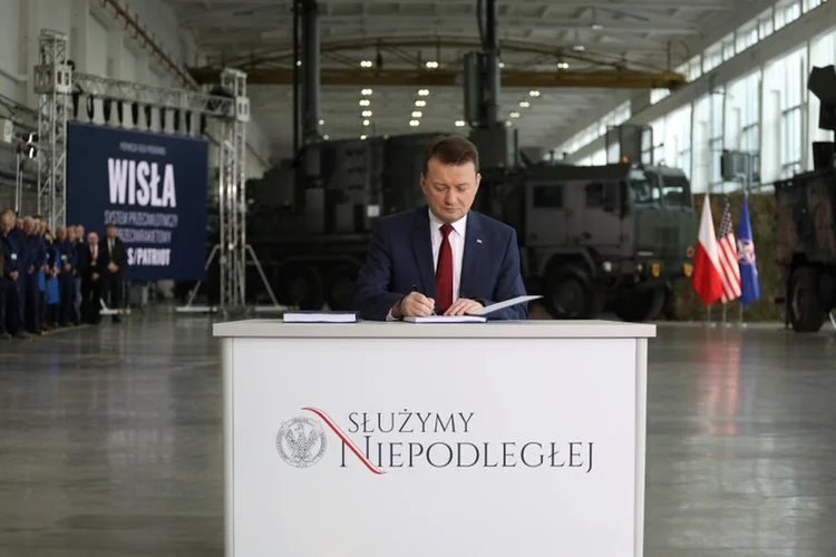 Polish Defense Minister Mariusz Blaszczak at the signing ceremony for the deal (KFGO)