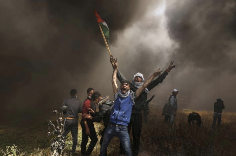 Palestinians shouting during the protests on the Gaza-Israel border on Friday. From: https://www.reuters.com/news/picture/deadly-protests-on-gaza-israel-border-idUSRTX5LMUG