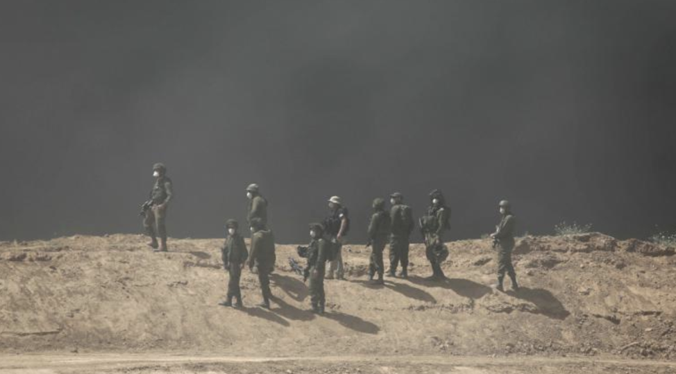 Israeli soldiers standing in smoke during protests at the Gaza-Israel border on Friday. From: https://www.cnn.com/2018/04/07/middleeast/gaza-israel-border-protest-deaths-intl/index.html