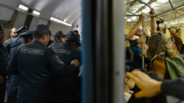 Opposition demonstrators block the doorway of an underground train during a protest on Apr. 16, 2018, against former President Serzh Sarksyan’s appointment as Prime Minister of Armenia (Karo Sahakyan/AP)