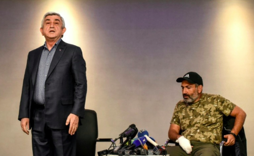 Embattled then-Prime Minister of Armenia Serzh Sarkysan (left) storms out of tense televised talks with opposition leader Nikol Pashinyan on Sunday, Apr. 22, 2018. Photo: AFP/File/Vano Shlamov