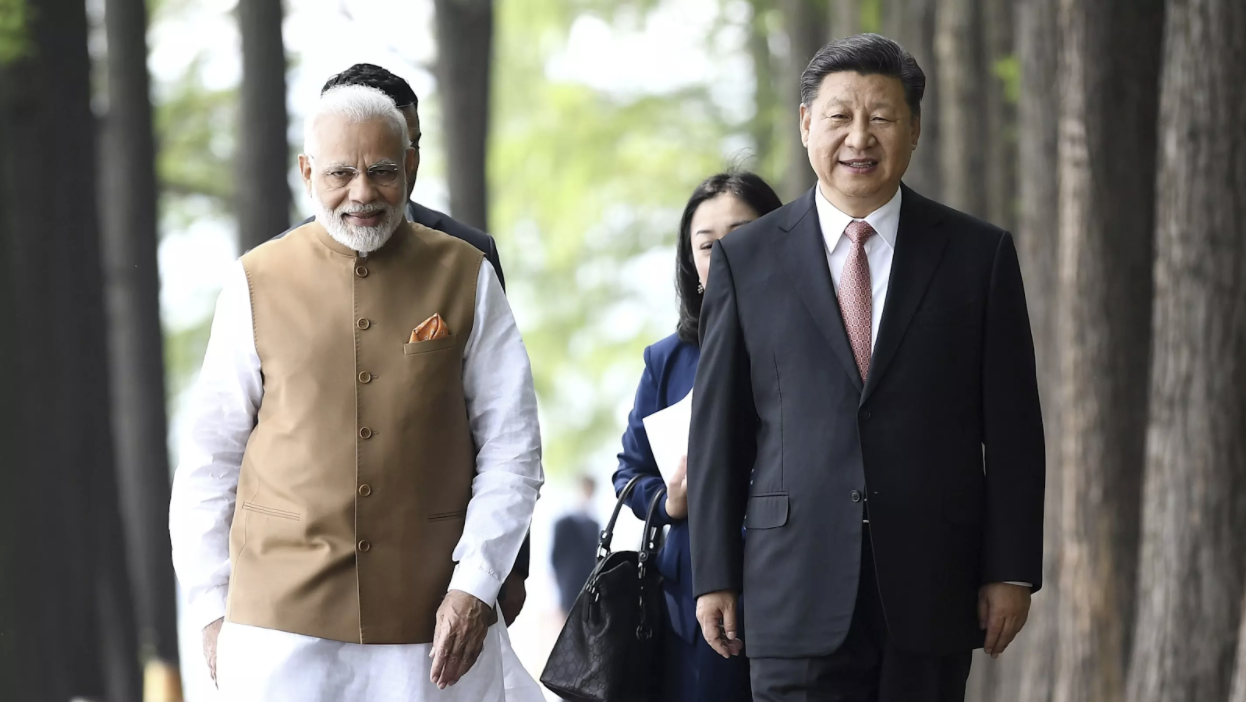 Indian Prime Minister Narendra Modi, left, and Chinese President Xi Jinping walk together in Wuhan, China, on April 28. Source: Xinhua/AP