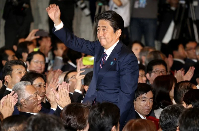 Incumbent LDP President Shinzo Abe acknowledges fellow party members’ applause after being announced the winner of the party presidential election at its headquarters in Tokyo on Sept. 20, 2018. Photo: Koji Sasahara/AP Photo
