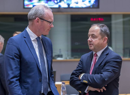 Irish Minister for Foreign Affairs and Trade Simon Coveney (left) and Polish Minister for European Affairs Konrad Szymanski chat during a break in a session of the General Affairs Council of the European Council on Sept. 18, 2018. Photo: European Union