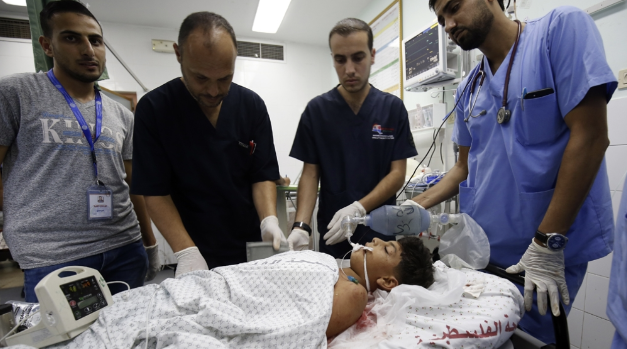 Youssef Abu Zarifa, a Palestinian boy, is treated for injuries from conflict on the Gaza border. Photo: AFP
