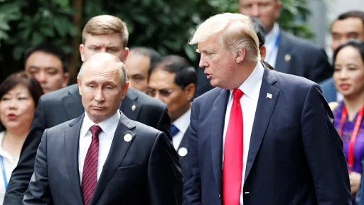 U.S. President Donald Trump and Russian President Vladimir Putin talk. Credit: Jorge Silva/Reuters/File Photo