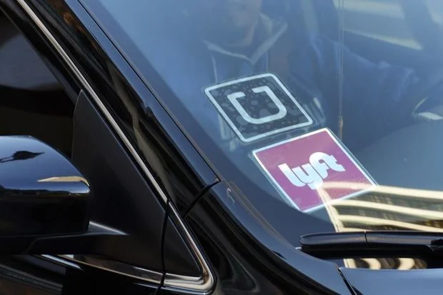 Ride-hailing company Lyft has filed for an IPO to try and reach the public market before rival Uber. Photo: Richard Vogel - Associated Press .