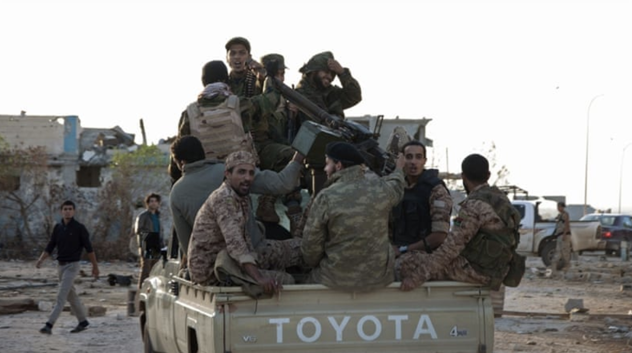 A group of general Khalifa Haftar’s forces ride in a truck in the Benina area, east of Benghazi. Credit: Reuters
