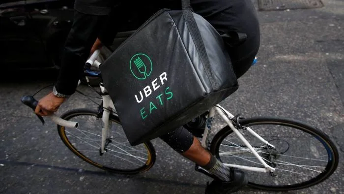 Uber Eats will serve as the delivery method for Starbucks’ coffee. Photo: Reuters .