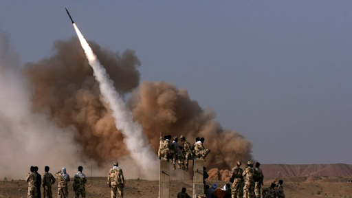 Iranian Revolutionary Guards personnel watch the launch of a Zelzal missile in Iran. June 28, 2011 Credits: AP