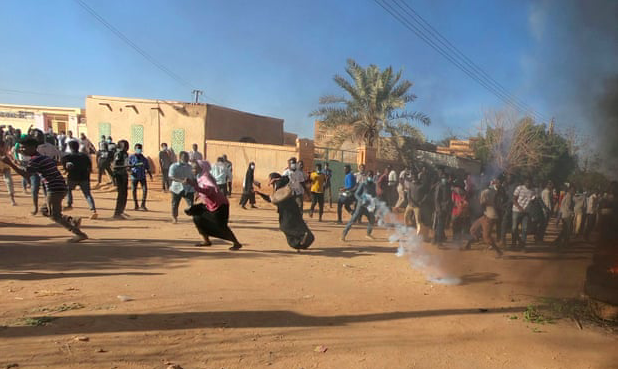 At a protest in January, riot police fire teargas to break up Sudanese demonstrators. Photo: Mohamed Nureldin Abdallah/ The Guardian via Reuters