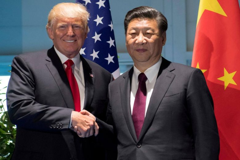 President Trump shakes hands with Chinese Premier Xi Jinping during a meeting in 2016 Photo: Straits Times via Reuters