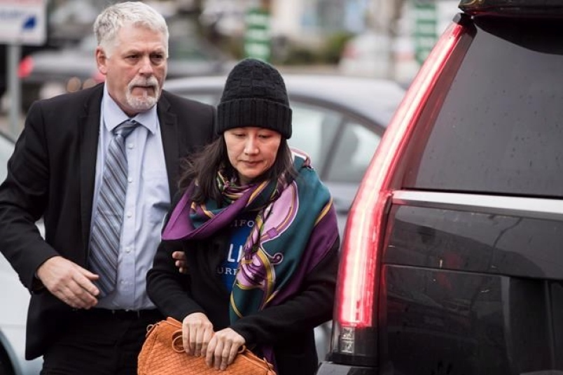 Meng Wanzhou leaving her home in Vancouver Photo: Darryl Dyck/Canadian Press