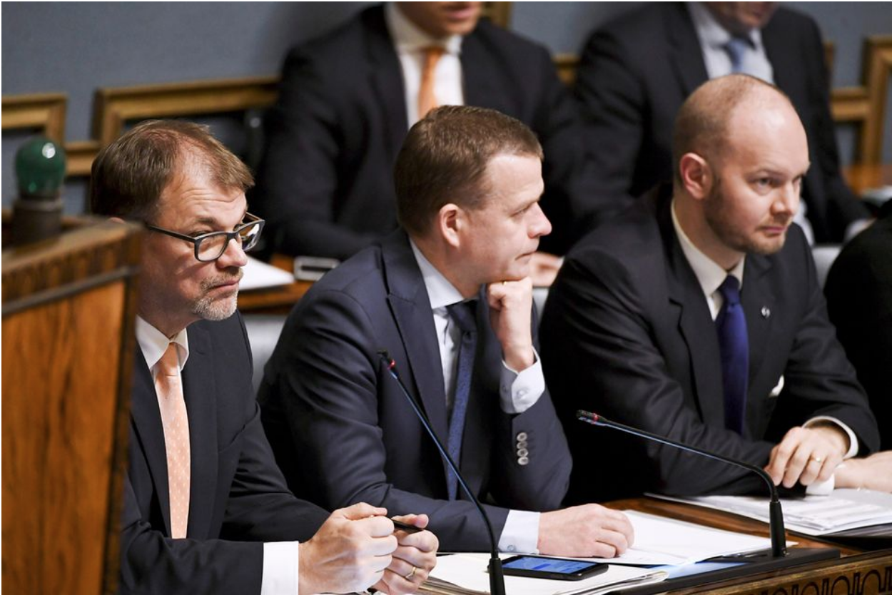 Prime Minister Sipilä (Kesk, left), Minister of Finance and Deputy Prime Minister Petteri Orpo (NCP, center), and Minister for European Affairs, Culture and Sports Sampo Terno (SIN, right) — leaders of the three parties in Sipilä’s coalition government — at a session of the Finnish Parliament. Photo: Vesa Moilanen/Lehtikuva