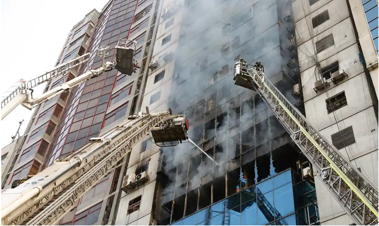 Firefighters were assisted by the navy and air force to rescue and extinguish the fire. Photo: Monirul Alam/ EPA