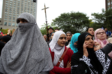 A 2013 Protest in Montreal against a proposal to restrict public employees from wearing face veils. Photo: Christinne Muschi/ Reuters .