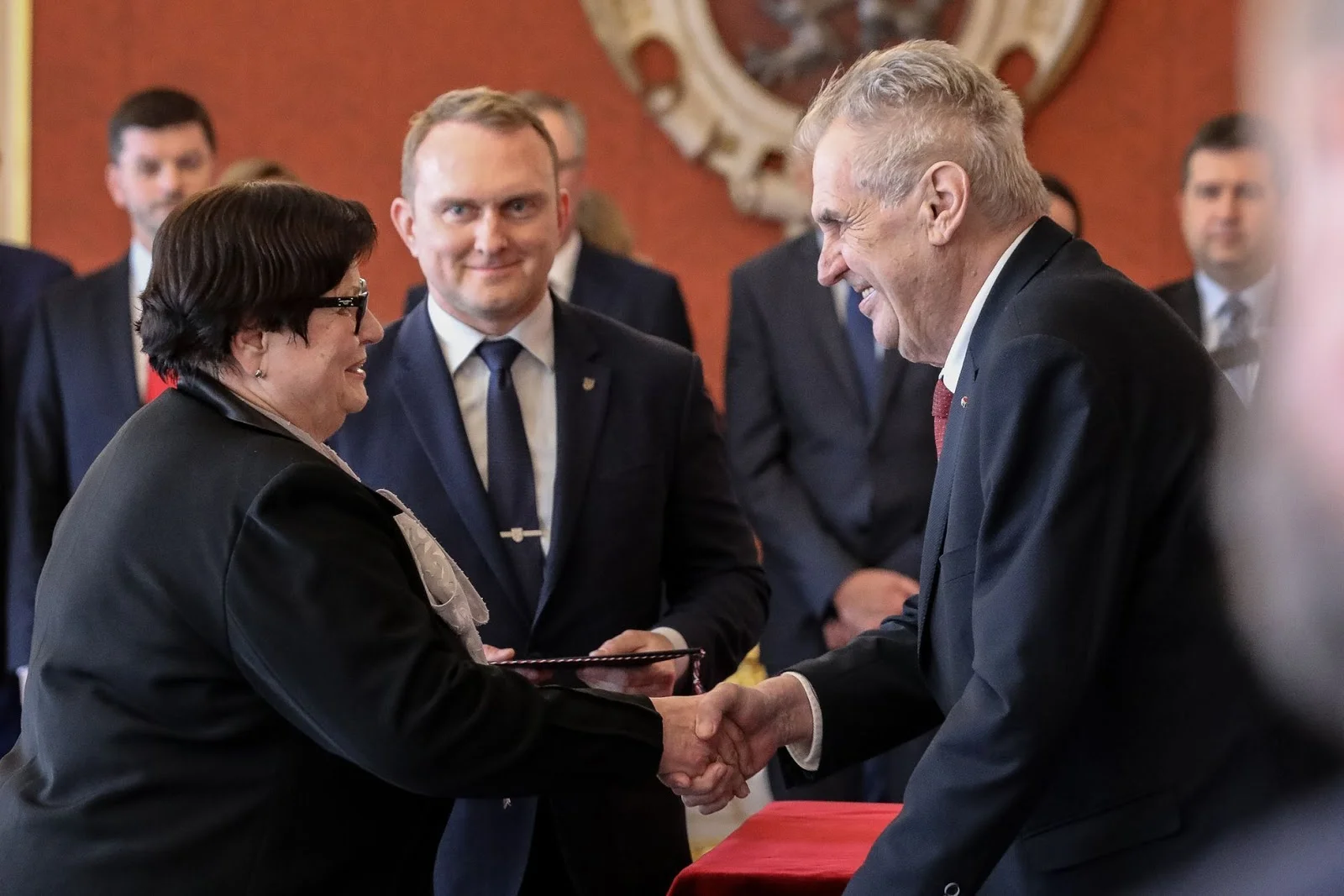 Marie Benešová and President Miloš Zeman shake hands. Photo. Source: Jakub Plihal, Aktuálně .cz