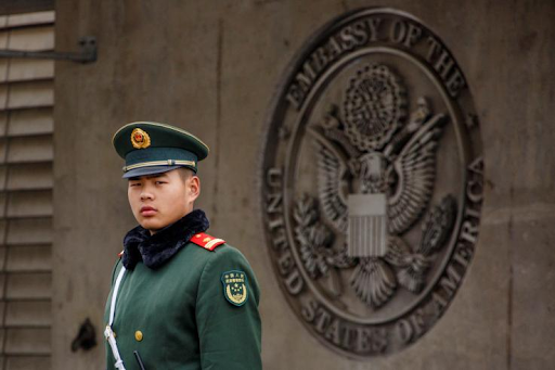 A Chinese paramilitary People’s Armed Police officer guards the entrance to the US embassy in Beijing on April 5, 2018. Photo: Reuters