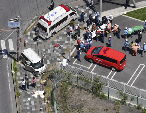 First responders tend to the wounded at the scene of the incident in Otsu, Shiga Prefecture, on Wednesday, May 8, 2019. Photo: KYODO