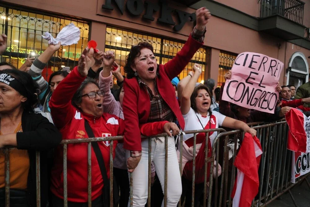 Demonstrators in the streets of Lima, Peru celebrate Vizcarra’s decision to close Congress. Photo: AP/Martin Mejia