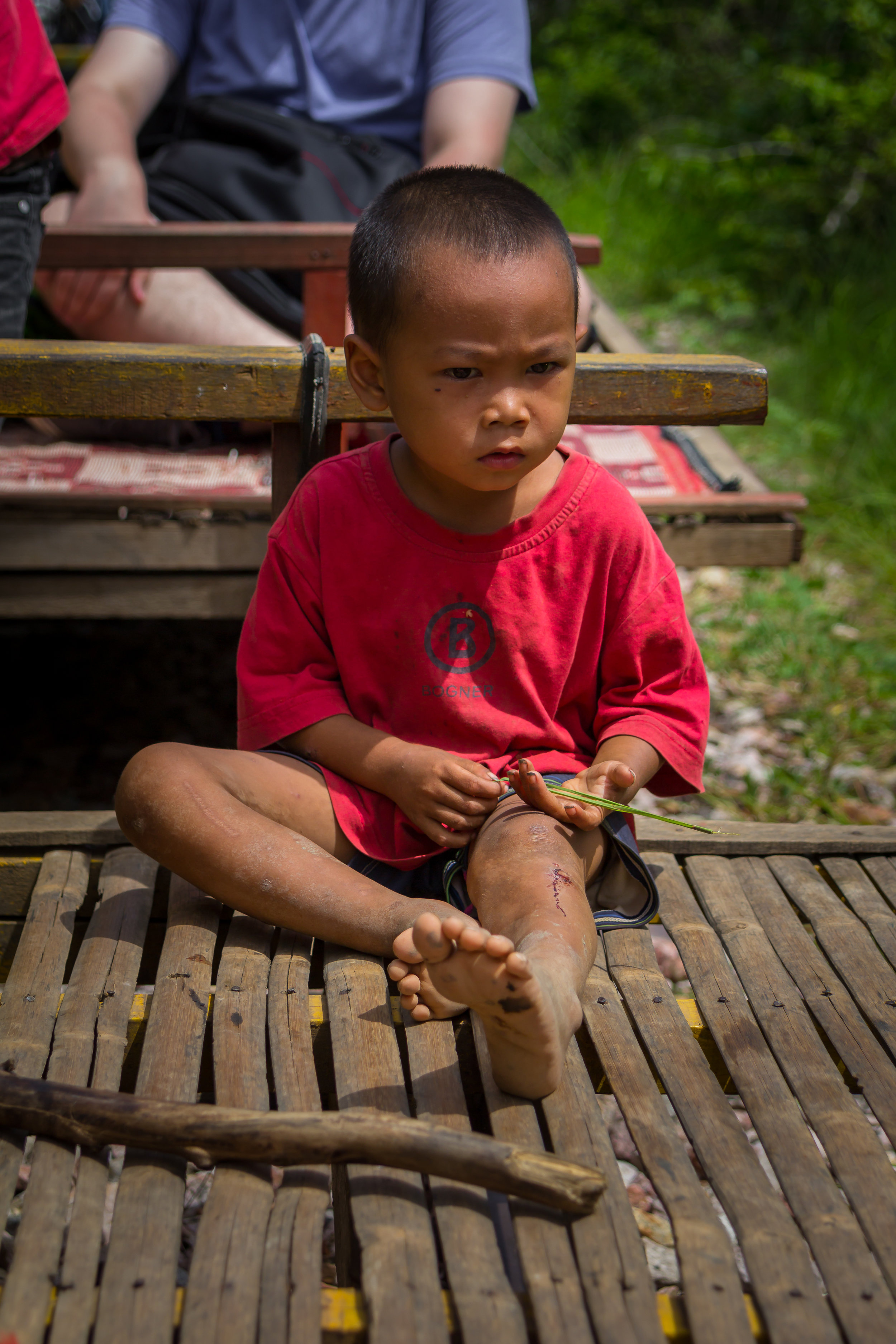 Bored boy on rails - Cambodia, August 2017
