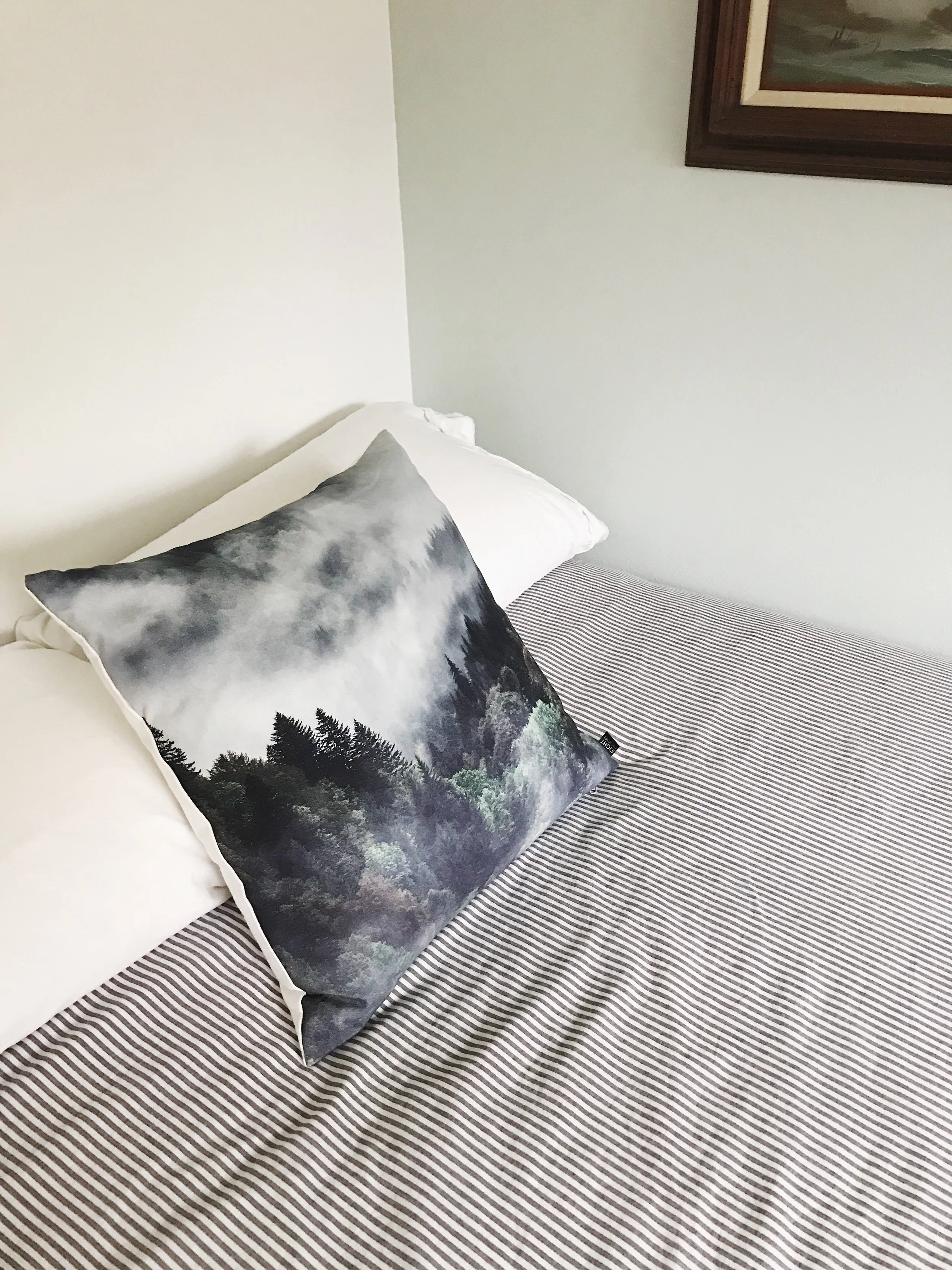 I'm pretty sure this pillow is the most expensive item in this room. It was one of those art pieces I just had to have. As soon as I brought it home I stuffed it in a closet far way from the reach of my dogs and toddler. A year or more later, I now finally have a place for it. Needless to say, this bed is now a kid and pet free zone.