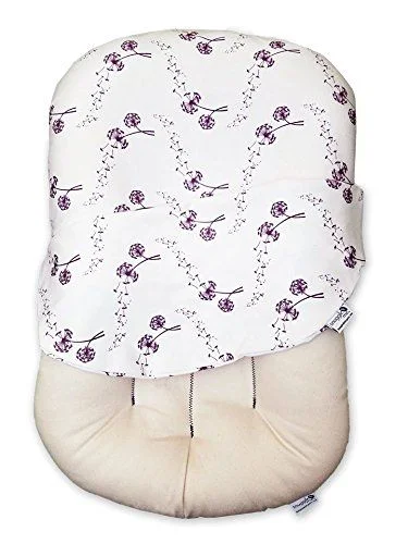 The Snuggle Me Organic co-sleeping pillow is similar to the popular Dock-a-Tot but actually made with natural and organic materials. They have a variety of filler and cover options, depending on your preference and budget.
