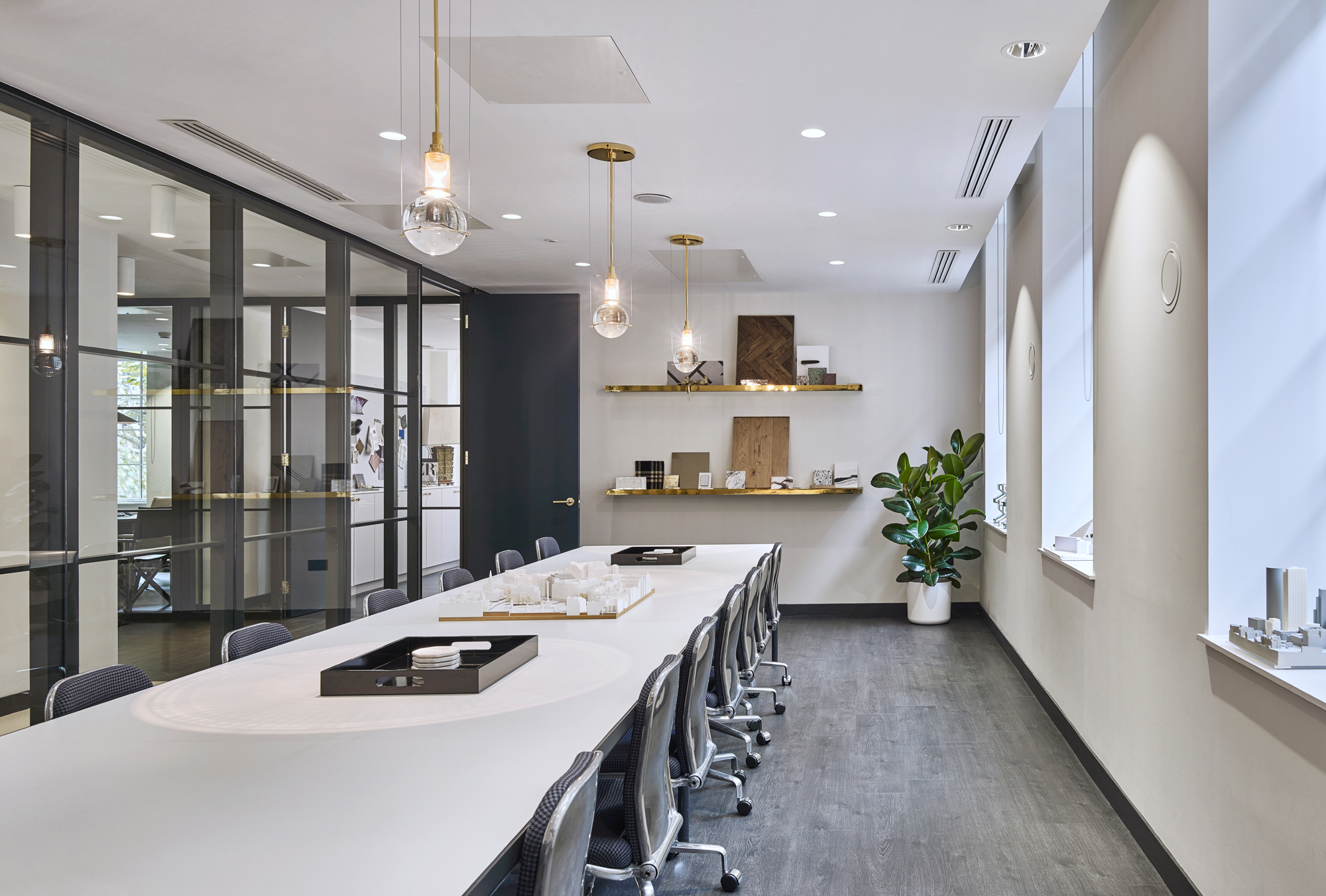 The main conference room could hold up to 30 persons and displayed Alchemi’s architectural models of past and current projects. The brass shelves held samples for their working projects and samples were swapped out to correlate with the relevant project meetings held.