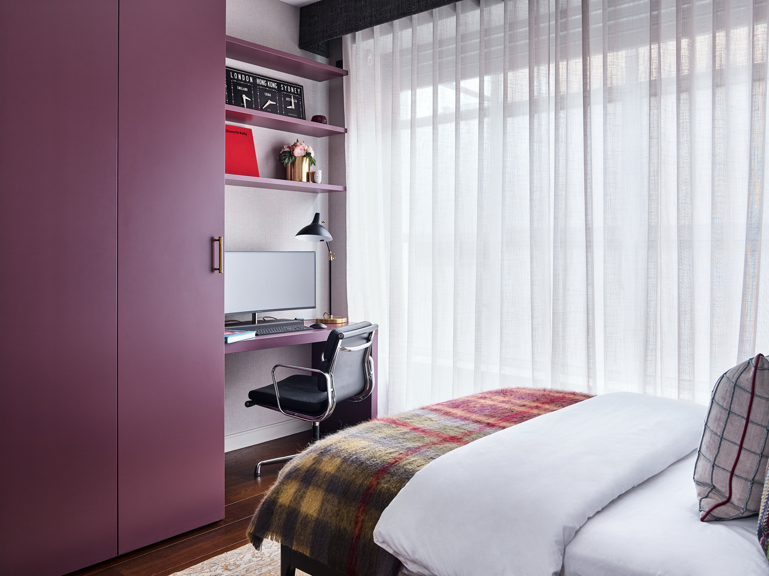 The guest bedroom also provides double duty as working home office. The unusual colour of the joinery grounded the room and added to the overall transformation.