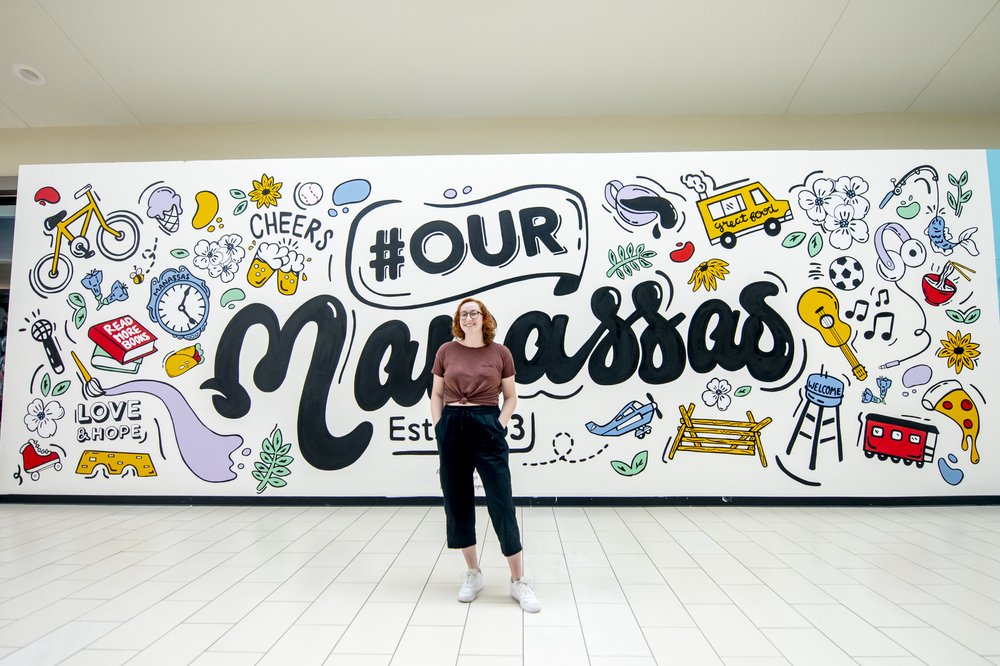  Artist Emma Dardis paints mural for Manassas Mall. Organized by Murals at Mason. Photo by:  Sierra Guard/Creative Services/George Mason University 