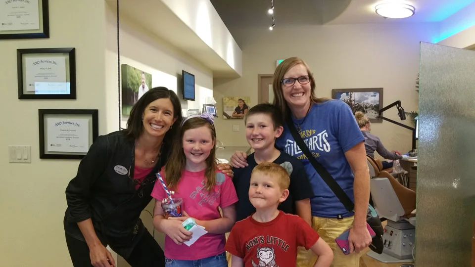 dr-jones-smiling-with-young-patients-7-to-9.jpg
