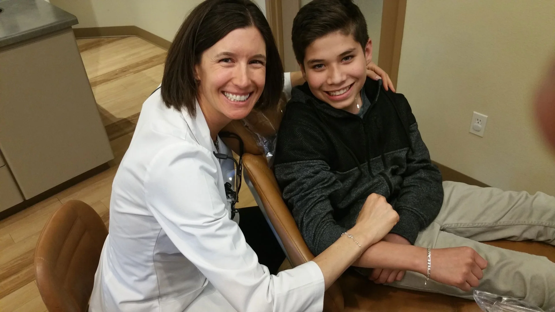 dr-jones-smiling-with-a-young-patient.jpg