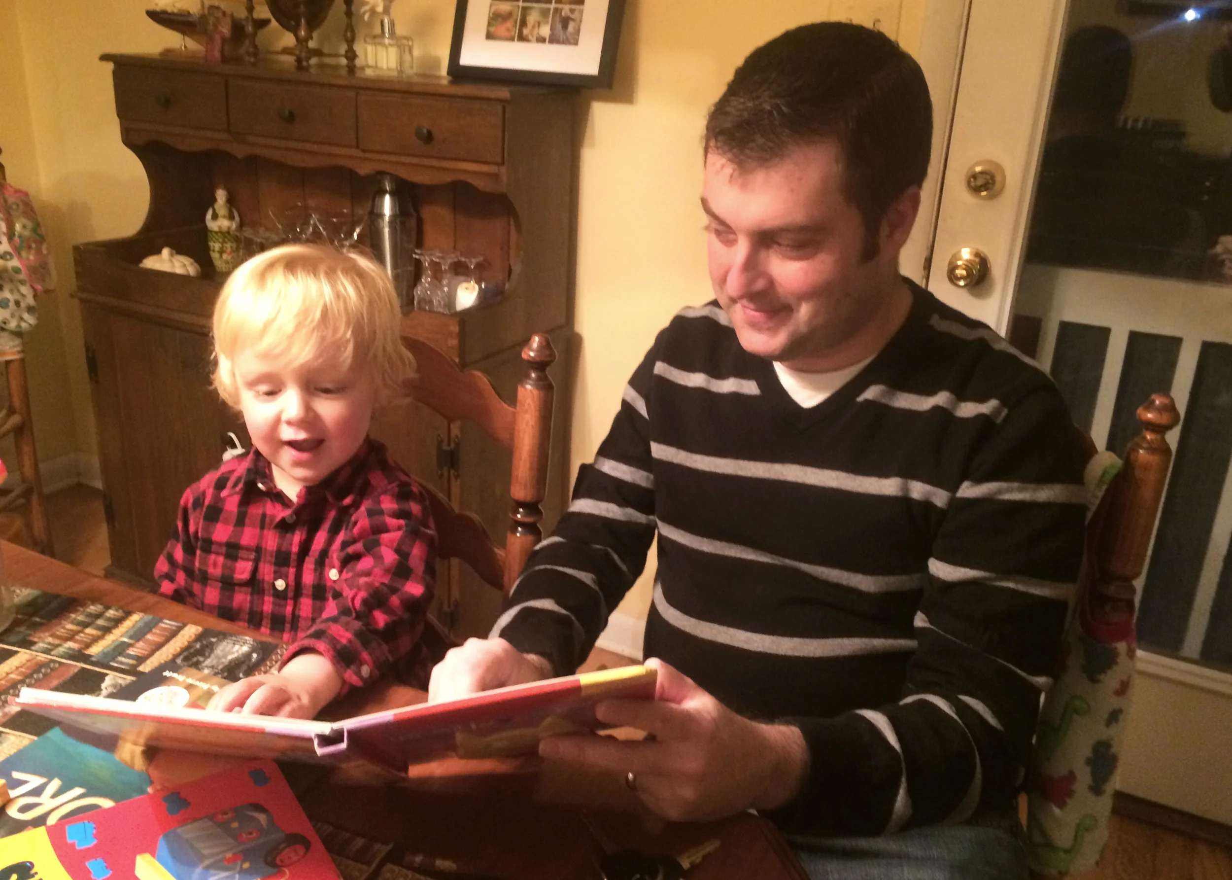 Daniel reads to nephew Milo