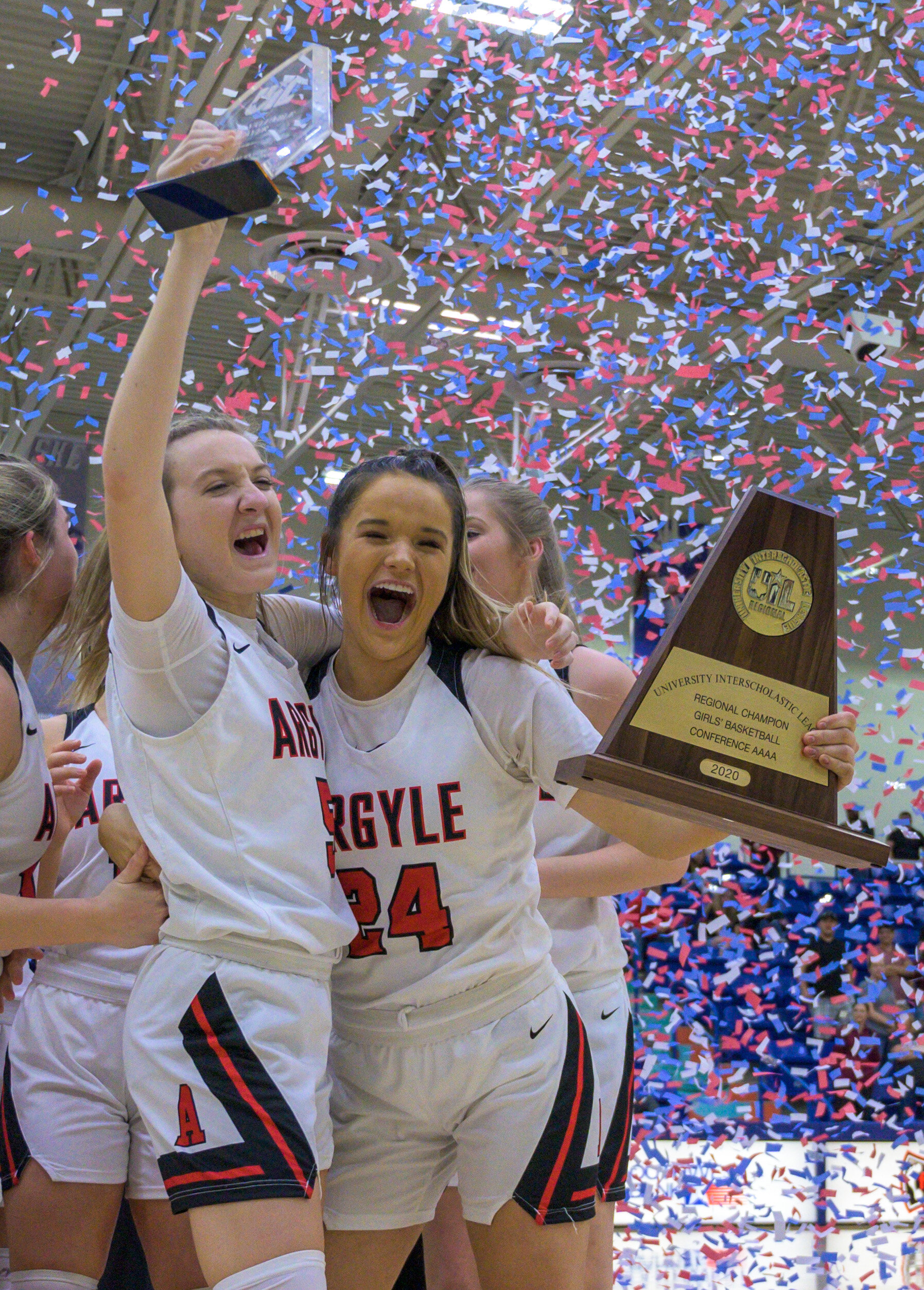  Denton Agryle’s Rhyle Mckinney, left, celebrates with Abby WIlliams, right, after winning the Class 4A Region I basketball game against Bridgeport at Lubbock Christian University in Lubbock, Texas. 