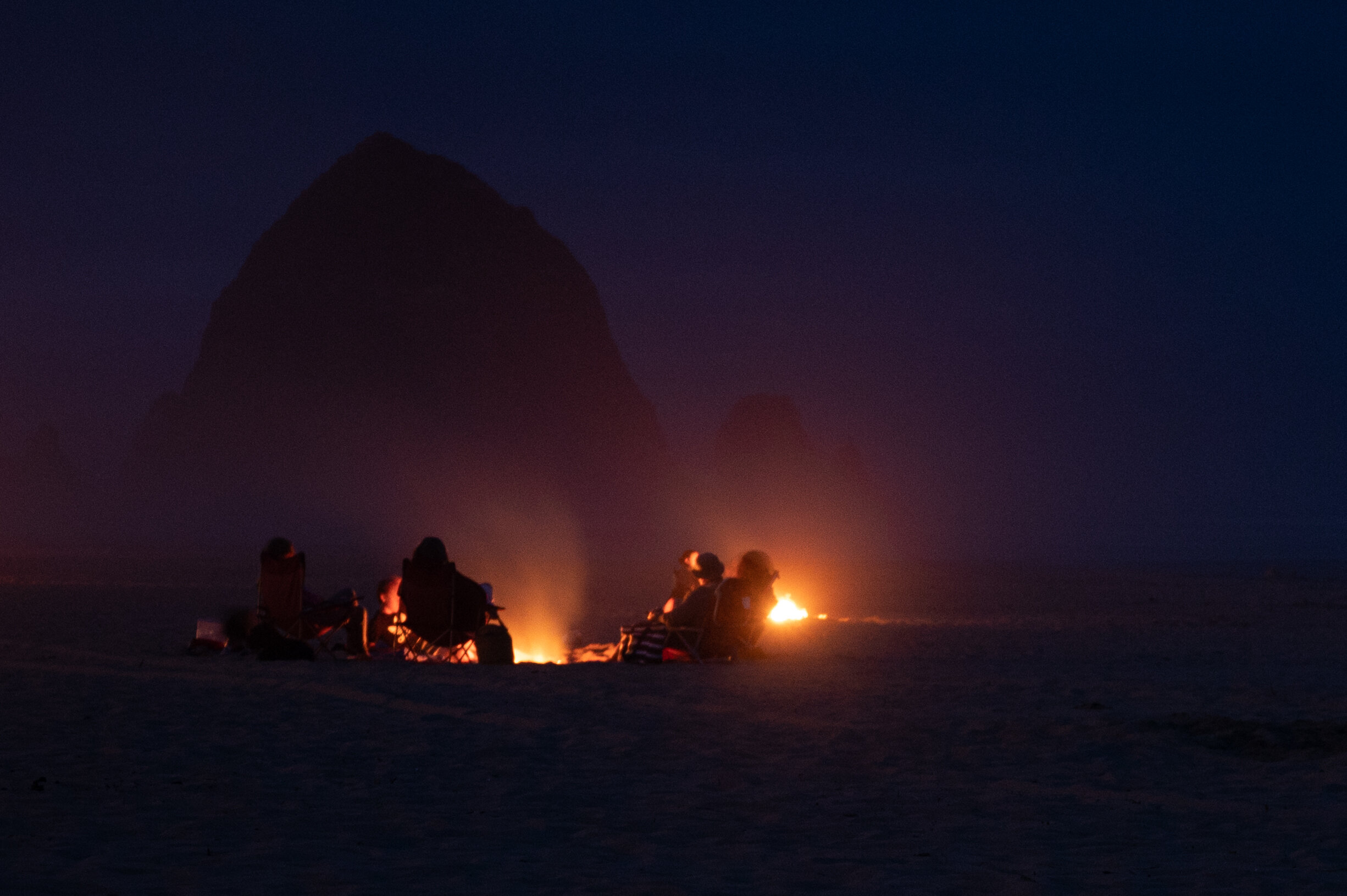  Groups set up fires near Haystack Rock on Wednesday, Aug. 5, 2020, in Cannon Beach, Ore.  